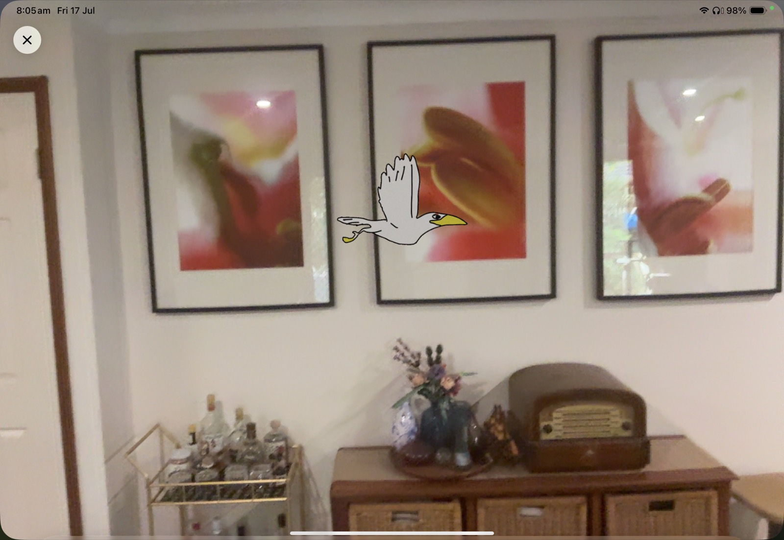 A student's drawing, flying in the room in AR